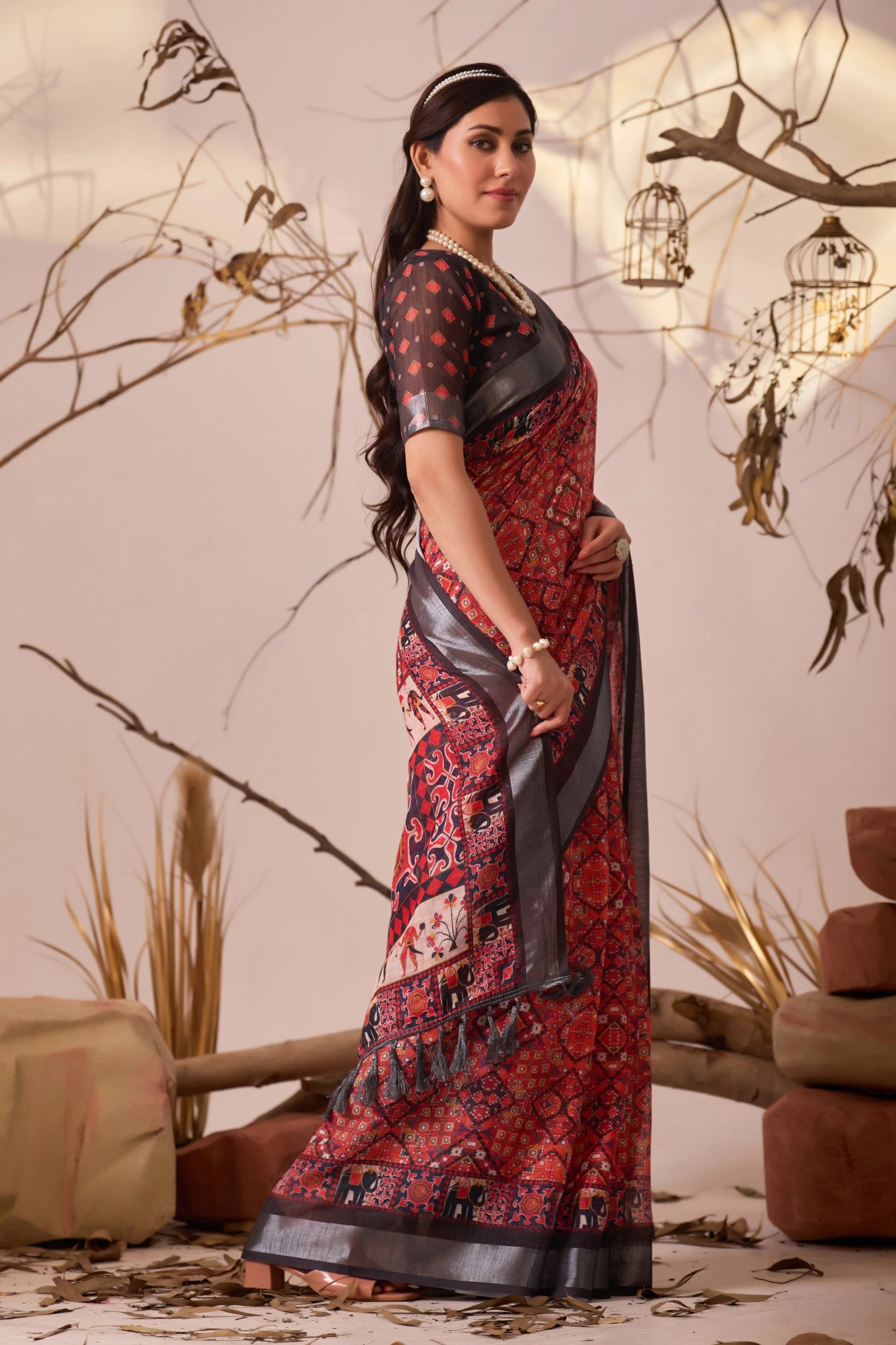 Woman in a traditional saree with a decorative background